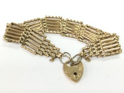 A 9ct gold five bar gate bracelet, 23.2g total weight