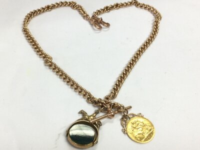 A 9k gold Albert chain with 1914 1/2 sovereign and 9ct gold bloodstone spinner. 54.8g total weight