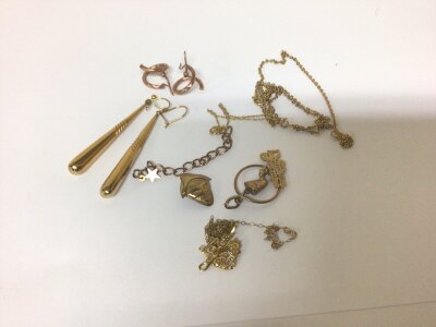 A collection of 9carat gold jewellery including earrings weighing 6g and other yellow metal and gold plated jewellery.