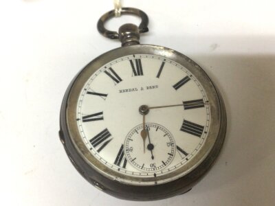 A Silver cased (900) Key Wind pocket watch with white enamel dial maker Kendal & Dent seen working.