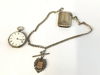 A silver pocket watch silver chain and vesta. 91.29g.