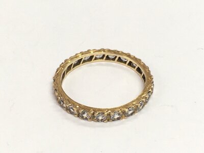 A 9ct gold full eternity ring set with clear stones, approx 2.5g and approx size V.