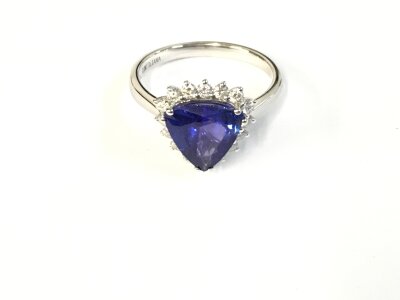 An 18ct white gold ring set with  Tanzanite. Size N 1/2 and 3.85g