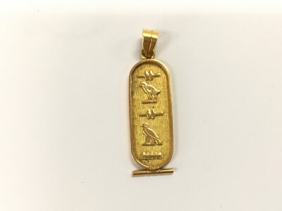A 14ct gold cartouche pendant. 4.35g
