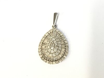 A 9ct white gold and diamond pendant. 1.90g