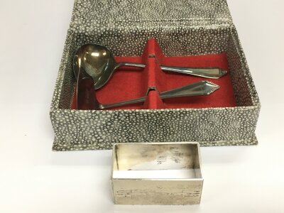 A silver napkin ring and a cased silver christening set.