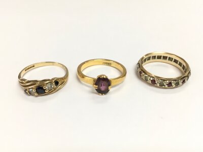 Two 9ct gold rings 4.60g  and a 22ct ring 3.20g set with various stones.