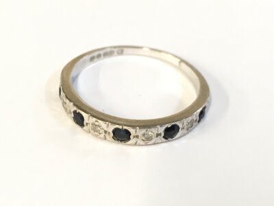 An 18ct white fold diamond and sapphire set ring. Size L 1/2 and 2.30g