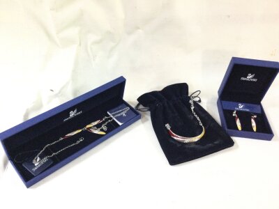 A Swarovski jewellery suite includes bracelet, necklace and earrings