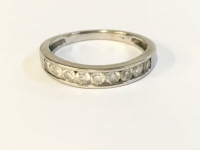 A 9ct white gold ring with diamonds . 2.50g and size N 1/2