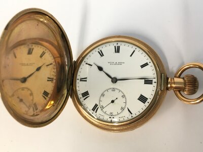 A gold plate button wind pocket watch Muir and sons. 50mm case winds and runs.
