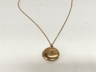 A 9ct gold back and front locket on chain. 4.63g