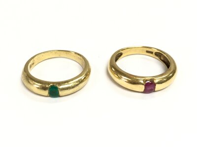Two gold rings one set with ruby and the other with emerald. Both size L1/2 and 9.52g