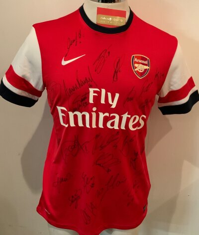 Arsenal 2013 - 2014 FA Cup Winners Signed Football Shirt: Red medium shirt with around 20 hand signed autographs in marker pen including Ramsey and Fabregas. C/W plaque for framing.