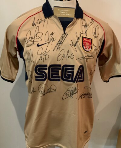 Arsenal 2001 - 2002 Signed Gold Sega Football Shirt: Large shirt with 19 hand signed autographs including Henry and Seaman Wilford and Campbell. C/W plaque as was previously framed.