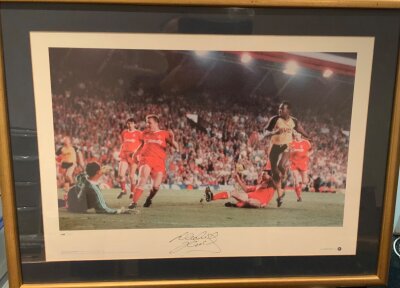 Arsenal Signed Framed Football Prints: Large Big Blue Tube framed prints depicting Michael Thomas scoring the league winning goal and Alan Smith scoring in the 1994 ECWC final. (2)