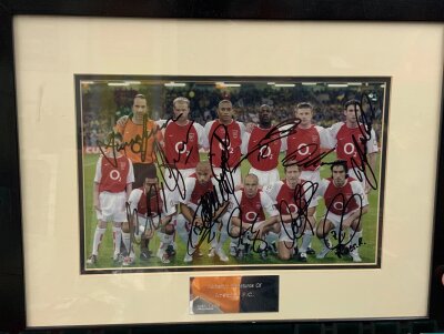 2003 Arsenal FA Cup Winners Signed Framed Football Photo: Pictured before the FA Cup final v Southampton with all 11 hand signed including Pires and Henry. COA from reputable source. Measures 18 x 14 inches.