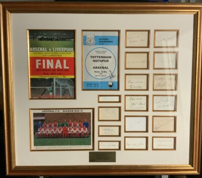 Arsenal 1970 - 1971 Double Winners Signed Framed Football Display: Attractive framed display measuring 29 x 25 inches. 16 genuine autographs with team group and original programmes of the FA Cup final and the league winning match at Tottenham. Signatures include Mee Howe Wilson McNab Kelly Nelson McLintock George and Graham. Nice item with COA from reputable source.
