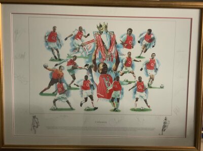 Arsenal Unbeaten 2003 - 2004 League Winners Signed Framed Football Print: Stunning print named Unbeaten measuring 28 x 38 inches in its nice frame. Genuine autographs x 14 with pictures of the team individually and with Vierra holding the Premier League trophy. Signatures include Reyes Campbell Henry Bergkamp and Cole. Limited edition number 206/500 of the great invincible team.