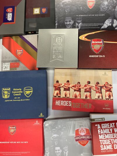 Arsenal Membership Packs + Football Memorabilia: 11 membership memorabilia boxes from different seasons plus Arsenal Monopoly, instructions to sell.