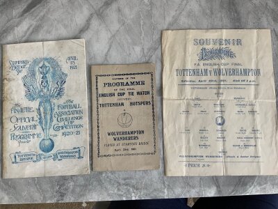 1921 FA Cup Final Football Programmes+ Menu: Tottenham v Wolves played at Chelsea. Official programme in fair good condition after professional repair, Pirate programme with tear on fold. C/W an C/W a single sheet that looks like it could have been produced by Chelsea for the final which also has a tear on the fold. (3)