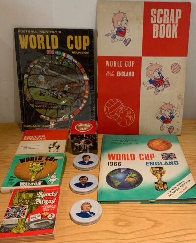 England 1966 World Cup Football Memorabilia: Lot includes scrapbook two 8mm films of the final. 3 jam lids featuring Moore Banks and Osgood. Soap on a rope in original box and books (10)