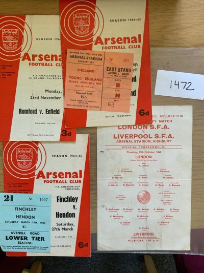 64/65 Football Programmes + Tickets Of Matches At Arsenal: England v Young England and Finchley v Hendon Amateur Cup semi final have both programmes and tickets. Includes single sheet for London Schools v Liverpool Schools and 3 single sheets of Islington Schools matches v Tottenham, Hackney and Finchley. Fair/good. (9)