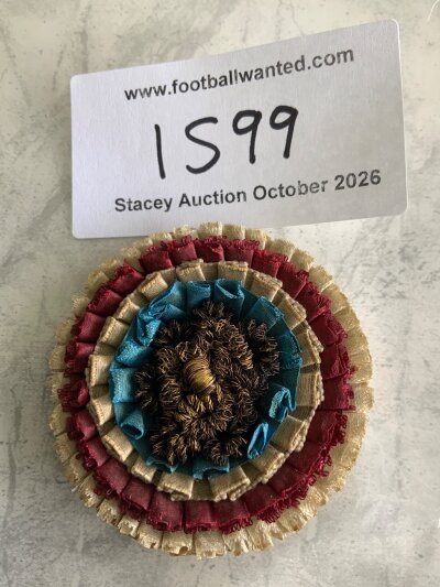 1895 FA Cup Final West Brom v Aston Villa Rosette: Worn by directors of either club and incredibly rare. Small rosette has claret and white and claret and blue surrounding a wire wool centre. Back reads George Kenning + Son London with hand written 1894-5. Old fashioned pin still attached.