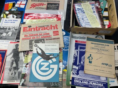 Football Programme Box: Includes a small selection of club record attendance programmes, European club programmes, 1958 poster with unverified Pele autograph, Tottenham aways at 73/74 Grasshoppers, 81/82 Eintracht, testimonials and benefits. Must view.