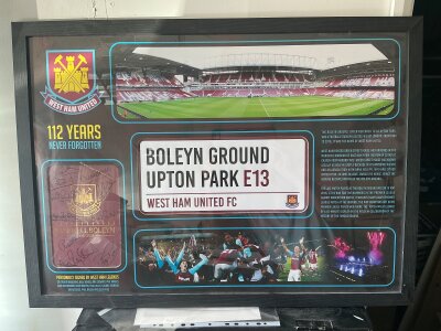 West Ham Boleyn Ground Framed Football Display: Includes a sign for Boleyn Ground, pictures from the last match v Manchester United and a panoramic view of the inside of the ground. The last programme v Man Utd has been signed to cover by 10 players from the 1980 FA Cup final winning team. Nice item measuring 25 x 35 inches.