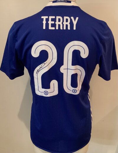 Chelsea 2016 - 2017 Signed John Terry Football Shirt: Blue short sleeve home shirt with Terry 26 to rear. Terry has signed on the number 2 clearly in marker pen. This was his last season of playing for the club.