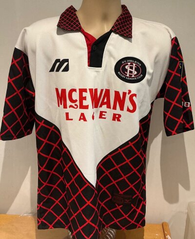 St Helens 1997 Rugby League Shirt: Match spare given to shirt supplier Mizuno after beating Bradford in the final at a celebration event. Unused shirt is size 38/40 and has Sky Sports Stones Super League to sleeve badging.