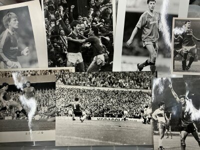Manchester United 1980s Football Press Photos: Black and white large photos with stamps to rear of both match action and individual players. (28)