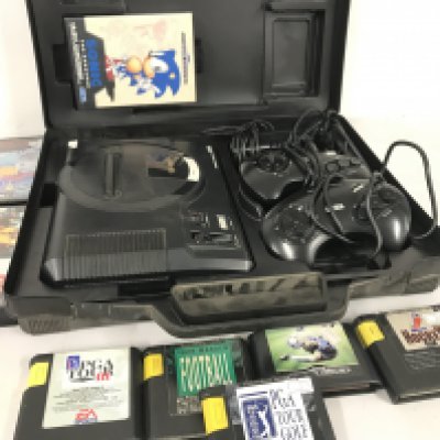 A Sega mega Drive Console and a Collection of Games.
