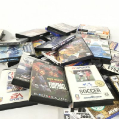 A collection of approximately 25 assorted boxed video games for various consoles.