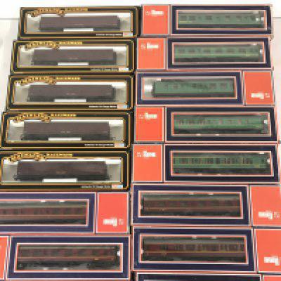 A Collection of Boxed 00 Gauge Coaches and Car Loaders by Bachmann and Llima.