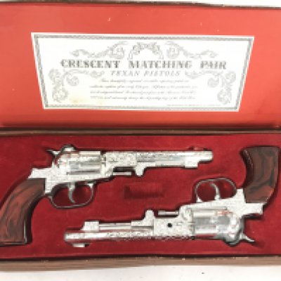 A Boxed Crescent Toys Matching Pair Of Texan Pistols