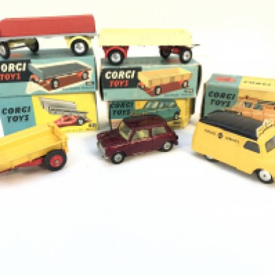 A Collection of Boxed Corgi Toys. A Platform Trailer #101. A Dropside Trailer #100. A Massey-Ferguson 30 CWT Trailer #51. A Mini-Minor #226 and a Bedford Road Service Van #408. No Reserve.