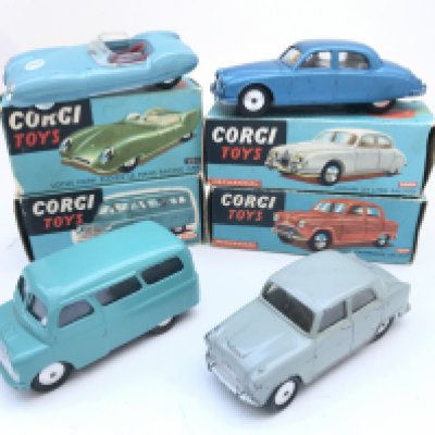4 X Boxed Corgi Vehicles including a Lotus Mark Eleven Le Mans Racing Car #151. A Jaguar 2.4 Litre Saloon #208m. A Bedford Dormobile Personnel Carrier #404M and an Aston Cambridge Saloon #201M. No Reserve.