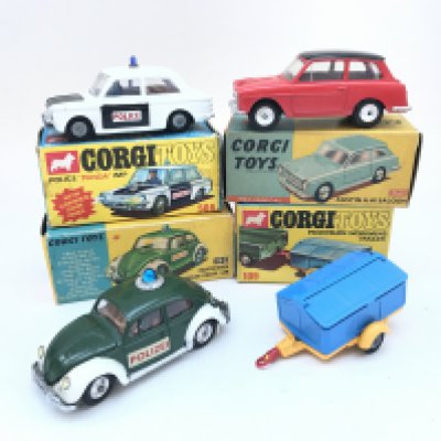 A Boxed Corgi Police Panda IMP 506 an Austin A.40 Saloon #216M A Volkswagen Police Car #492 and a Pennyburn Workman's Trailer #109.
