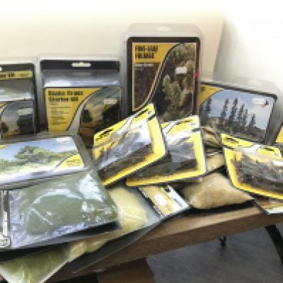 A collection of new sealed packages by Woodland Scenics for creating scenes for model layouts. No reserve