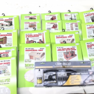 A collection of Metcalfe Card Construction Kits all unopened. Includes small factory..industrial units and department store plus others. All 00 scale. A sealed Tidy Track Rail Tracker cleaning kit suits various track gauges. No reserve