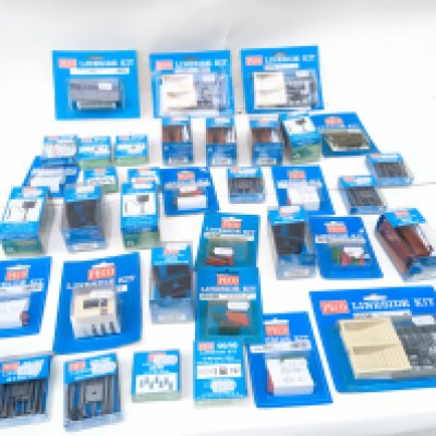 A collection in excess of 35 new unopened PECO Lineside kits in 00 scale . Includes weighing machine..bookstall..subway staircase etc. no reserve