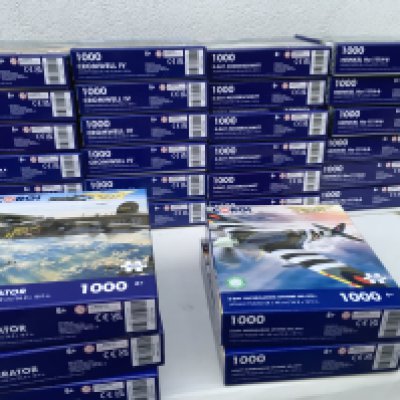 A retail display stand for Corgi Aviation Archive 1000 piece jigsaw puzzles. Includes 29 new puzzles all are warplanes, British, German and American. Includes D day Spitfire and Heinkel. Also featuring the Cromwell IV tank. No reserve