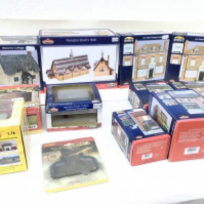 A collection of model buildings by Bachman&acirc;n in 00 gauge. Also includes 2 Hornby pieces and 1 by Scenix. All new and boxed. No reserve