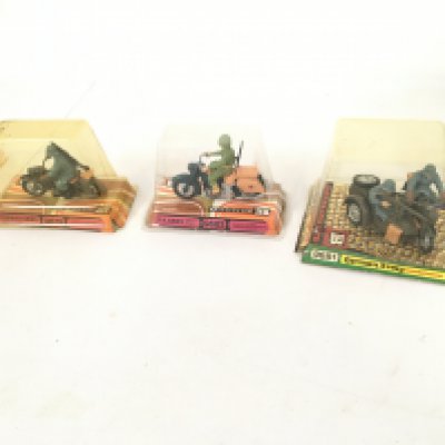 A group of 3 Britains model military motorcycles featuring German and US armies. Features 9679. 9681..9682 in original display packaging. No reserve