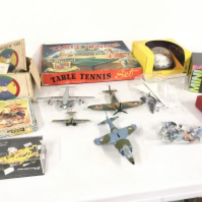 A collection of assorted toys including Table Tennis..Dominoes..puzzle..vintage Rainbow Top. Also includes diecast model planes by Dinky and others..cars and Millenium Dome. Plus Britains figures. 1930s shove Penny Board  No reserve