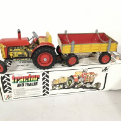 A boxed Fetor clockwork Tractor and Trailer . No key. No reserve