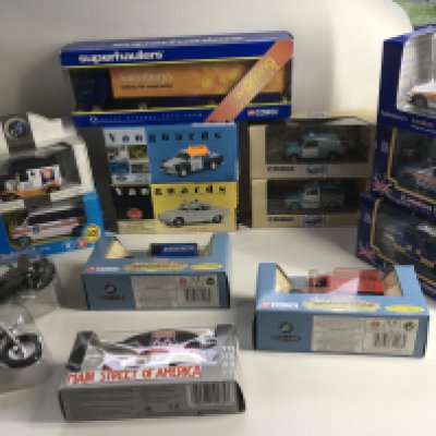 A collection of 13 boxed diecast model vehicles by Corgi..Vanguard and others. Includes two plastic model motorcycles.