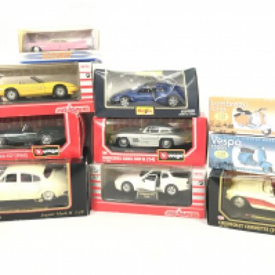 A Collection of Boxed Diecast including Burago. Maisto. Dinky. Matchbox etc.
